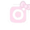 A light pink camera icon decorated with a matching pink bow on the top right corner.