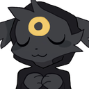 A dark-furred creature with a golden ring on its forehead has its eyes closed in a peaceful, happy expression.