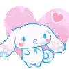 A small white puppy with floppy ears and pink cheeks stands in front of a pink heart.
