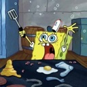 SpongeBob SquarePants looking panicked while holding a spatula over a messy kitchen counter.