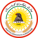 Eagle perched on a banner inside a yellow sunburst with red circular border and text.