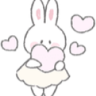 A white cartoon bunny holding a pink heart with floating hearts around it.
