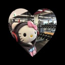 Hello Kitty wearing a hoodie and headphones in a gym, framed by a heart shape.