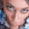 A person's face shown in a repeating, pixelated close-up, staring intensely at the viewer.