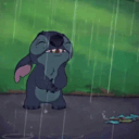 Stitch stands in the rain looking sad and crying.