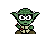A small green creature with large eyes holding a glowing green energy sword.
