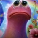 A pink, blob-like creature with large, watery, tear-filled eyes and a downturned mouth looking up in despair.