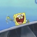SpongeBob SquarePants smiling widely and waving his hand in the air.