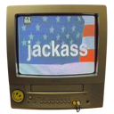 A vintage television set with a smiley face sticker on the corner displaying an American flag and the word jackass on the sc…