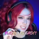 A young woman with bright red hair and a headset smirking with text that reads FUGGING EASY.