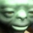 A close-up of a green, Yoda-like character looking with a skeptical and unimpressed expression.