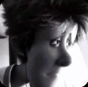 A close-up of a 3D character face with wide, suspicious eyes looking to the side.