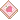 A pink strawberry-patterned notebook next to an open book with a fried egg illustration in a pixel art style.