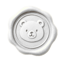 A white wax seal stamp embossed with a simple bear face.