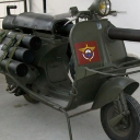 Vespa 150 TAP military scooter equipped with a large recoilless rifle mounted on the frame.
