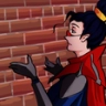 Anime character with dark hair and a red cape throwing hands up in confusion against a brick wall.