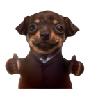 A brown dog wearing a black suit and tie giving a double thumbs-up gesture.