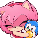 A pink character with closed eyes happily hugging a small blue plushie holding a golden ring.
