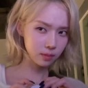 A blonde woman looking sideways with a skeptical and judgmental expression.