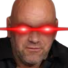 A bald man with glowing red laser eyes staring intensely.