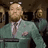Conor McGregor walking confidently while wearing a tailored suit in a multi-frame sequence.