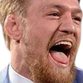 Man laughing with his mouth wide open and tongue visible.