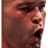 Man with a wide open mouth expressing intense shock or excitement.