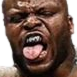 Man with a beard sticking his tongue out in a mocking, intense expression.