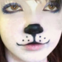 A close-up of a person's face with digital puppy-dog makeup, including a black nose and whiskers.