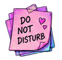 A pink sticky note with the text Do Not Disturb and two small hearts, layered over other colorful papers.