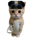 A small ginger kitten wearing a police cap and holding a pair of metal handcuffs.