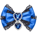 A blue ribbon bow decorated with two heart-shaped blue gemstones surrounded by silver crystals.