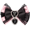 A decorative bow made of pink and black fabric with a silver heart-shaped jewel charm in the center.