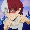 Shoto Todoroki making a heart shape with his hands while smiling.