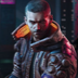 A man with a short haircut and a leather jacket looking forward with a serious, intense expression.