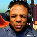 Man with headphones has his eyes closed and lips puckered in a silly, exaggerated expression.