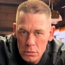 John Cena looking directly at the camera with an intense, serious, and unblinking expression.