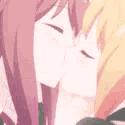 Two anime characters with closed eyes leaning in to kiss each other in a repeating loop.