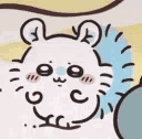 A small white creature with large eyes and pink cheeks rapidly shaking and vibrating.