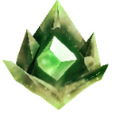 A glowing green crystal embedded in jagged rock, radiating a bright light.
