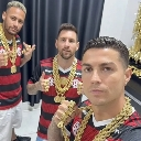 Neymar, Lionel Messi, and Cristiano Ronaldo wearing Flamengo jerseys and thick gold chains.