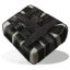 A square, dark-colored explosive block with light-colored bindings in a pixel art style.
