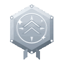 A silver hexagonal badge with a double chevron symbol and sparkling accents.