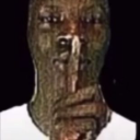 Person with a distorted, high-contrast face holding a finger to their lips in a shush gesture.