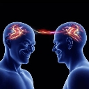Two blue human head silhouettes facing each other with a glowing red electrical spark connecting their brains.