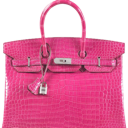 A bright pink textured handbag with silver hardware and a hanging lock charm.