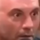 Man with wide, intense eyes expressing a look of shock and disbelief.
