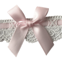 A soft pink satin bow tied over a strip of white decorative lace.