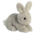 A small, fuzzy gray rabbit plush toy sitting on a white surface.