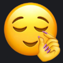 A yellow smiley face with closed eyes and a smug expression, holding its thumb and index finger close together to show a tin…